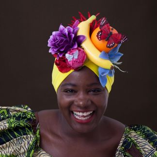 Smiling woman wearing a fruity turban